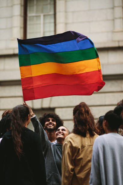 istock Happy parade goers in gay pride march 1215069169