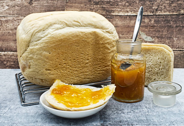 home made bread with apricot jam. traditional italian home made bread - wheat pasta flour italy imagens e fotografias de stock