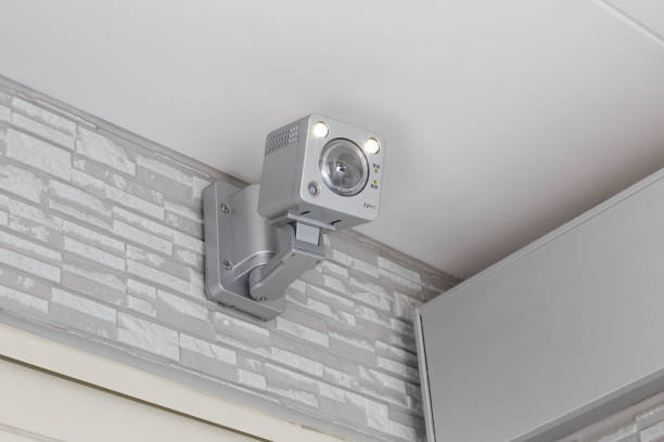 istock CCTV security camera for home protection, privacy, security against crime & surveillance, mounted on house exterior wall. 1215075166