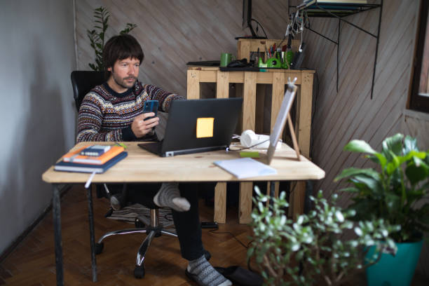 istock Social distanced man works from home 1215080884