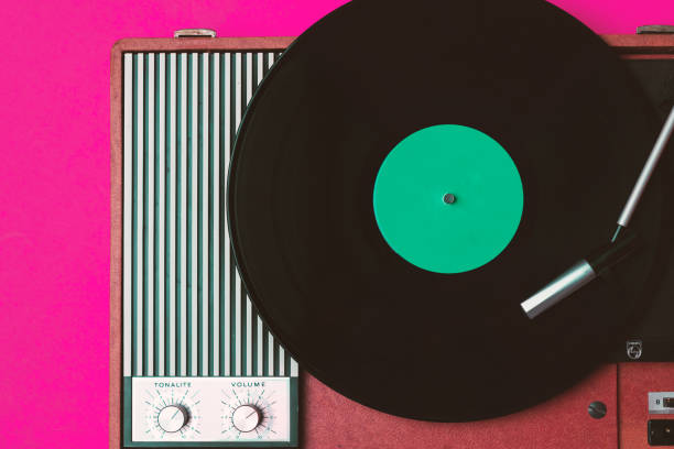 istock Retro vinyl player and turnable on a fuchsia background 1215082756