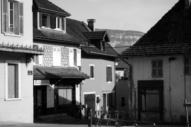 Novalaise, France - August 7th 2016 : View of several houses, with a big mountain of the french Alps in background.