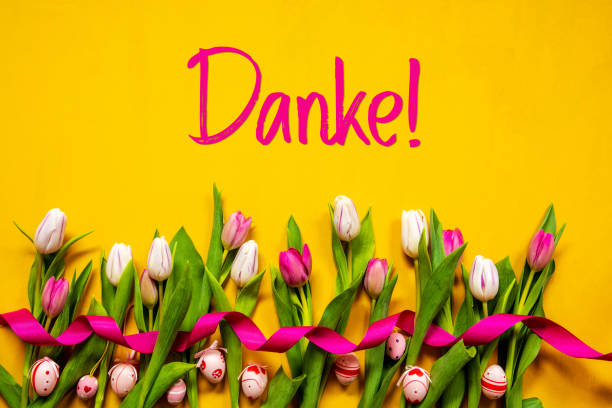 istock Colorful Tulip, Danke Means Thank You, Easter Egg, Yellow Background 1215084359