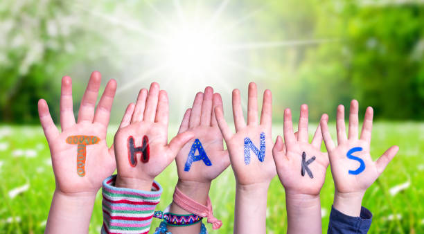 istock Children Hands Building Word Thanks, Grass Meadow 1215084404