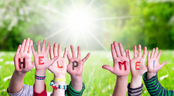 istock Children Hands Building Word Help Me, Grass Meadow 1215084460