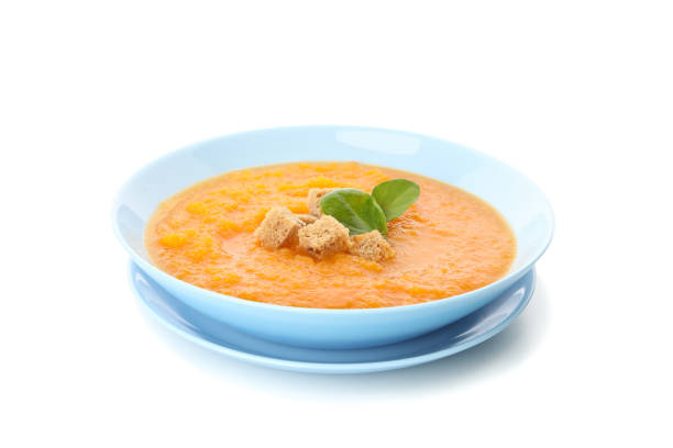 istock Pumpkin cream soup isolated on white background 1215084707