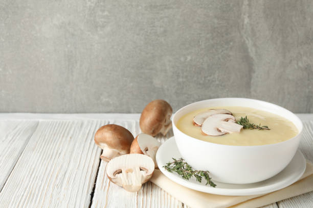 istock Mushroom cream soup on wooden background, space for text 1215085848