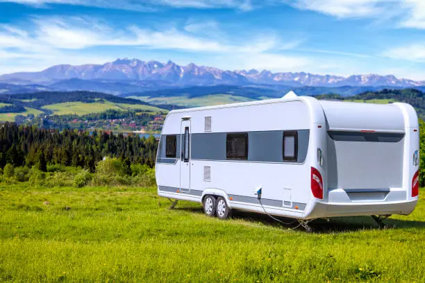 Holidays in Poland - camper trailer by the Czorsztyn lake and Tatra Mountains landscape