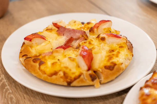 istock Pizza Hawaiian with pineapple and ham 1215085979
