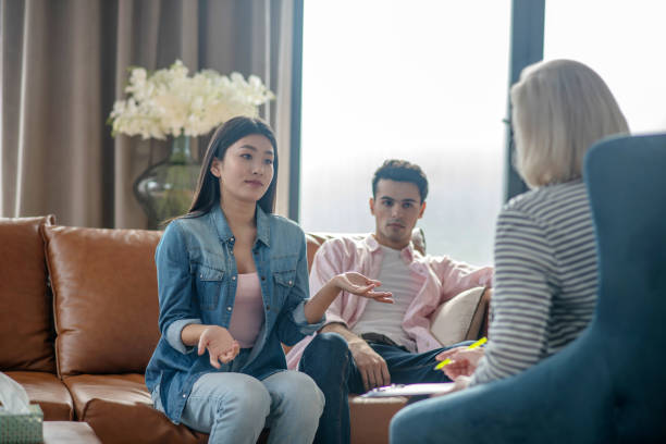 istock Dark-haired young woman telling her problems to psychologist 1215086868
