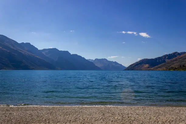 Photo of Lake Wakatipu on a free Campground outside of Queenstown during midday, New Zealand