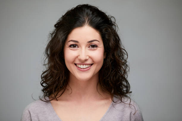 istock Young Spanish woman headshot wore looking at camera. 1215088458