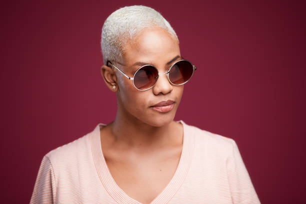 istock Young hispanic woman's portrait with sunglasses. 1215088481