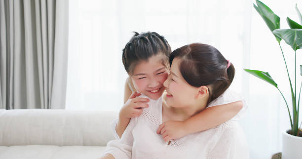 istock daughter whisper to mother 1215088656
