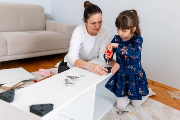 mother and daughter unpacking and fixing things DIY