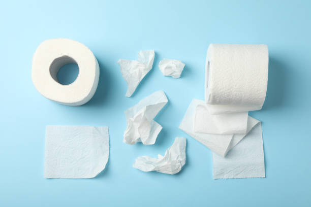 istock Flat lay with toilet paper on blue background, top view 1215089850