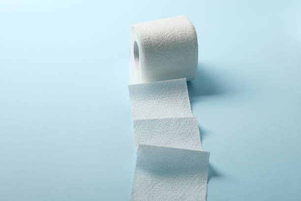 istock Toilet paper on blue background, space for text 1215090073