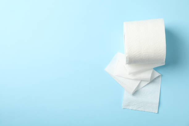 istock Toilet paper on blue background, space for text 1215090114