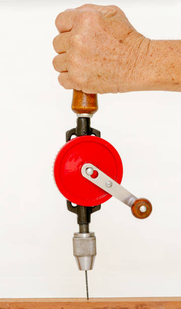 istock Left hand hold hand drill for drilling wooden 1215090754