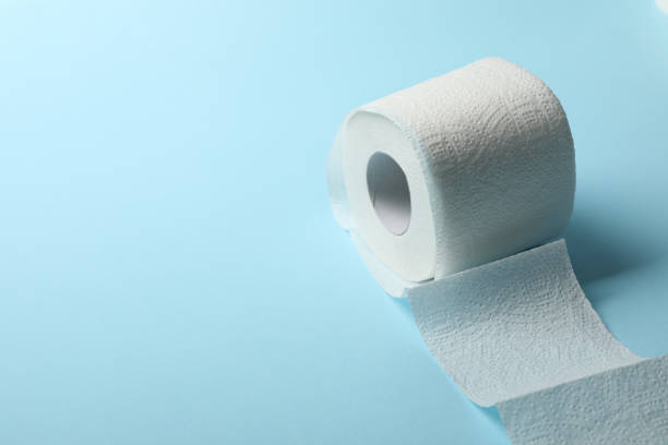 istock Toilet paper on blue background, space for text 1215091106