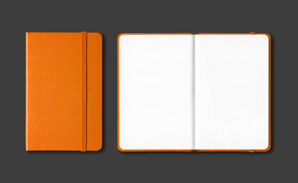 istock Orange closed and open notebooks isolated on black 1215092280