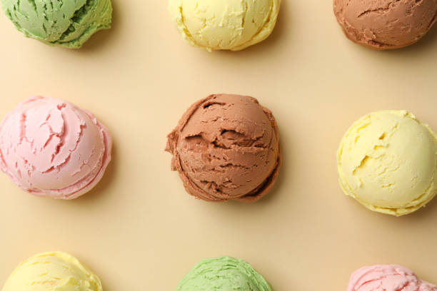istock Ice creams balls on beige background, top view 1215092759