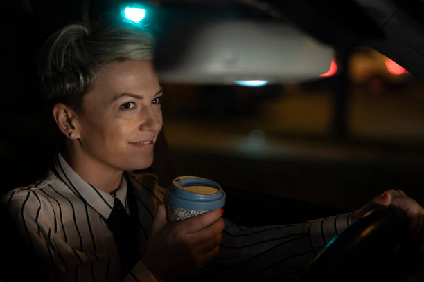 istock Smiling woman in a car 1215093617