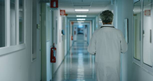 istock Doctor walking in a hospital ward. 1215093706