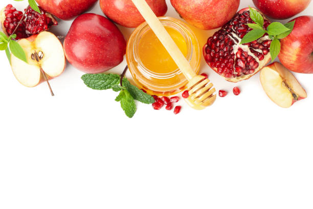 istock Apples, pomegranate, mint and honey isolated on white background. Natural treatment 1215094940