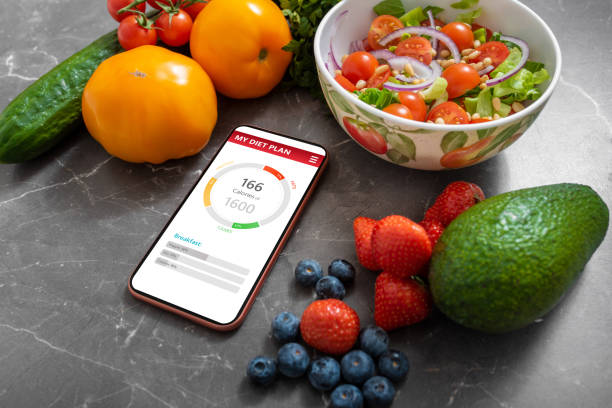 istock Smartphone with healthy meal planning app 1215095518