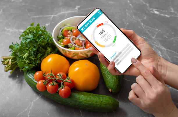 istock Woman using dieting app on phone 1215095583