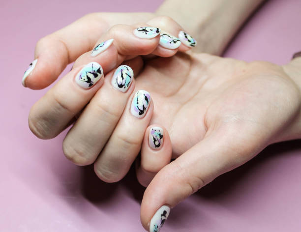 istock Modern manicure Abstract nail design on white Gel Polish 1215096272