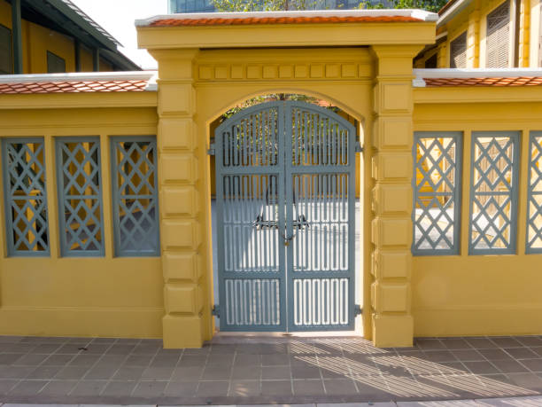 istock Walls with wooden doors are vintage yellow. 1215098596