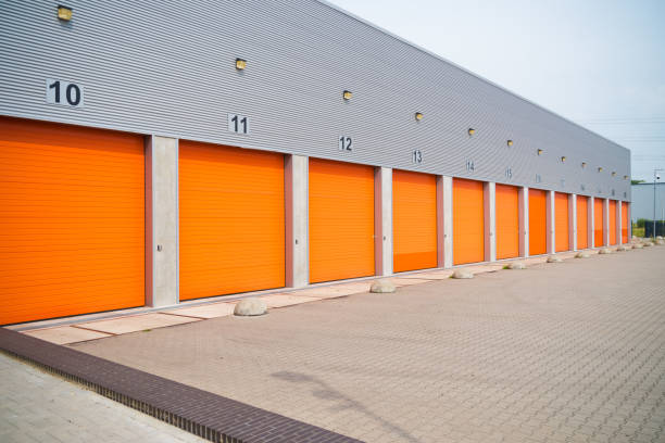 warehouses with orange roller doors stock photo