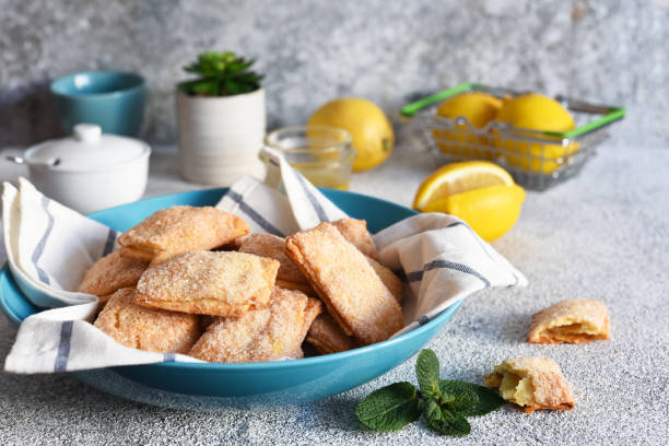 istock Lemon cookies with sugar and zest on the kitchen table. 1215100032