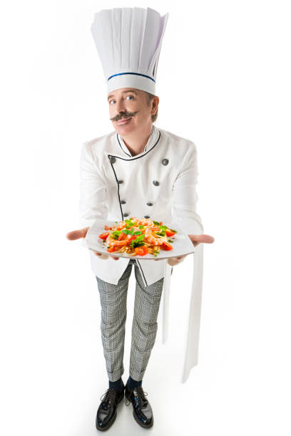 istock Chef cook with a shrimps pasta 1215100357