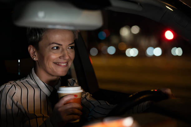 istock Smiling woman in a car 1215102093