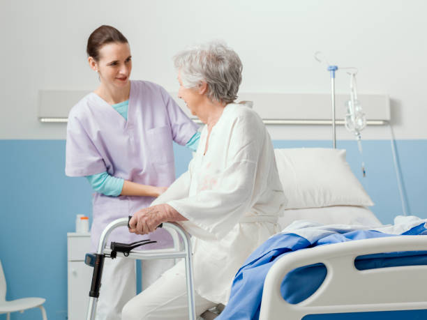 istock Professional nurse helping a senior patient at the hospital 1215106949