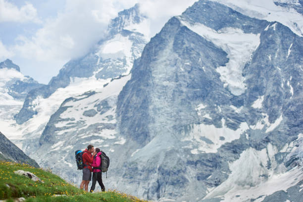 istock Couple traveling in mountains scenery. 1215108334