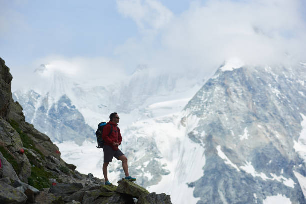 istock Tourist looking at mountains with snow. 1215108380