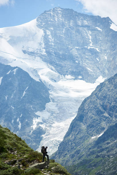 istock Tourist enjoying mountains scenery. 1215108388