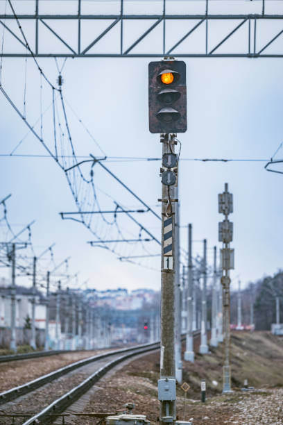 istock Trafficlight by the railway track. 1215108807