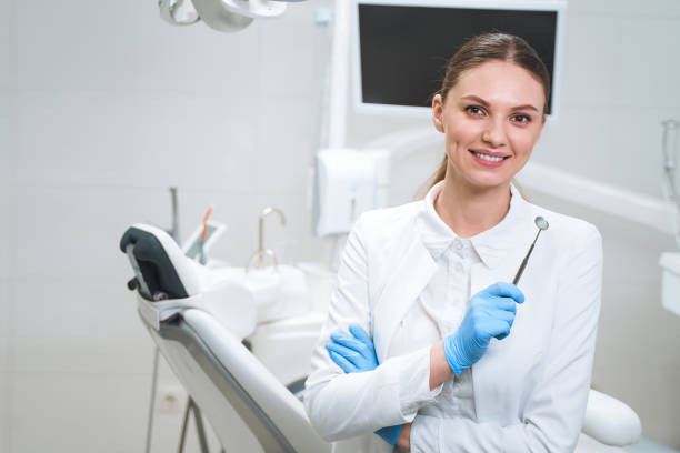 istock Smiling pretty dentist with tools stock photo 1215110781