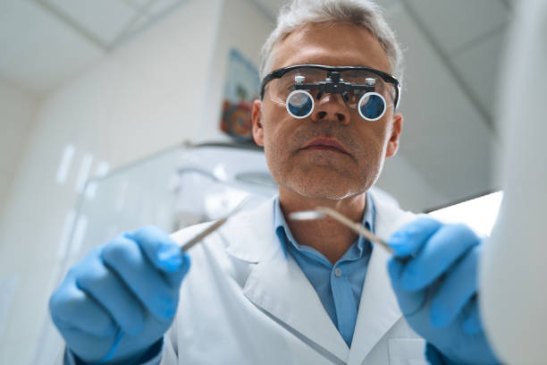istock Professional dental professional with tools stock photo 1215110795