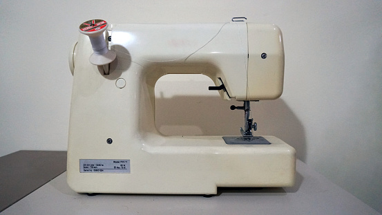 white sewing machine in fashion industry