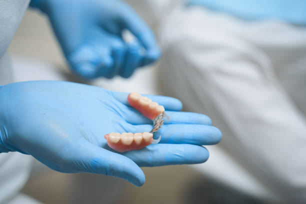 istock Dentist holding implants in hand stock photo 1215111742