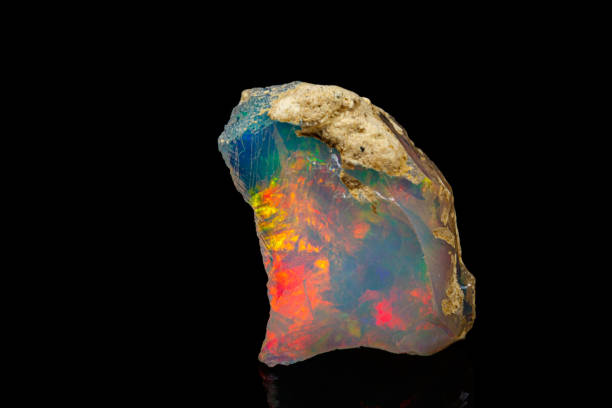 macro mineral stone rare and beautiful opals on a black background macro mineral stone rare and beautiful opals on a black background close-up opal photos stock pictures, royalty-free photos & images