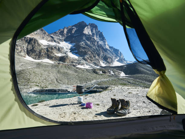 istock View from tent on mountain lake. 1215113383