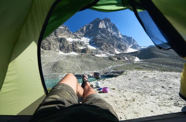 istock View from tent on mountain lake. 1215113387