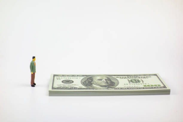 istock People and cash on a white background 1215118493